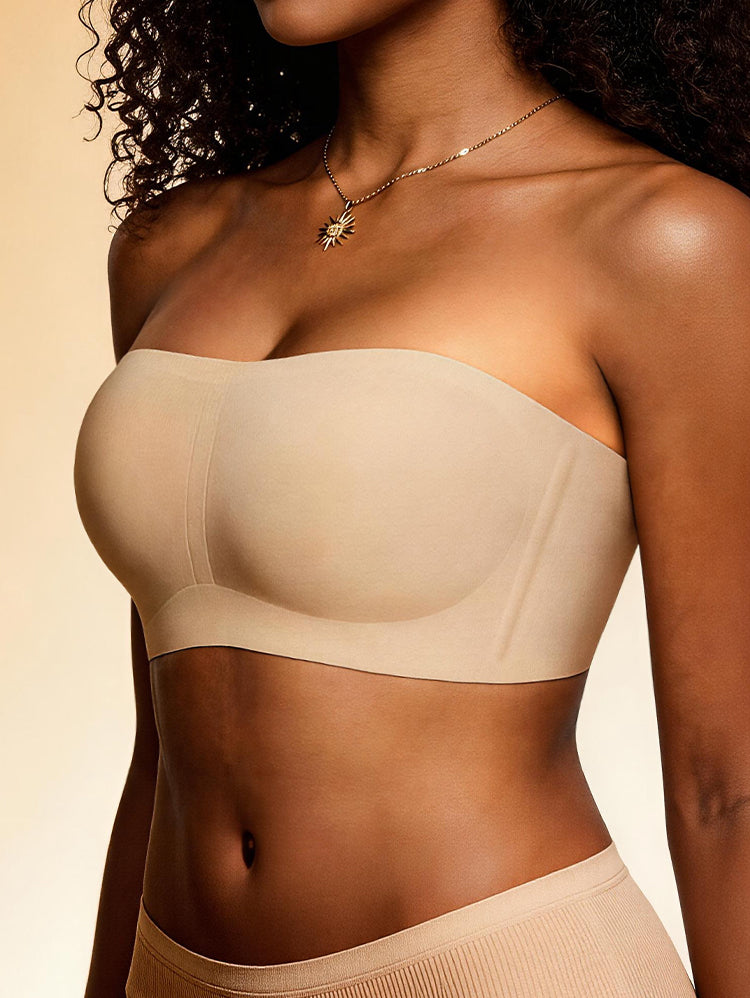 Nude seamless strapless bandeau bra side view with gold necklace styling